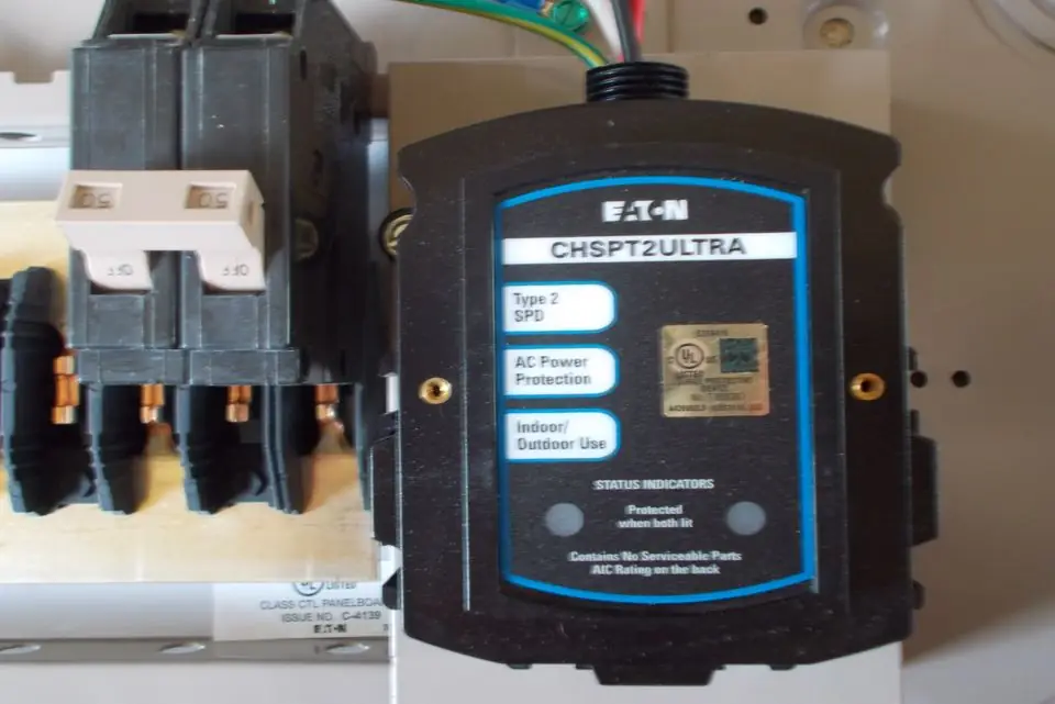 Eaton whole home surge protection device installed and landed inside a residential breaker panel